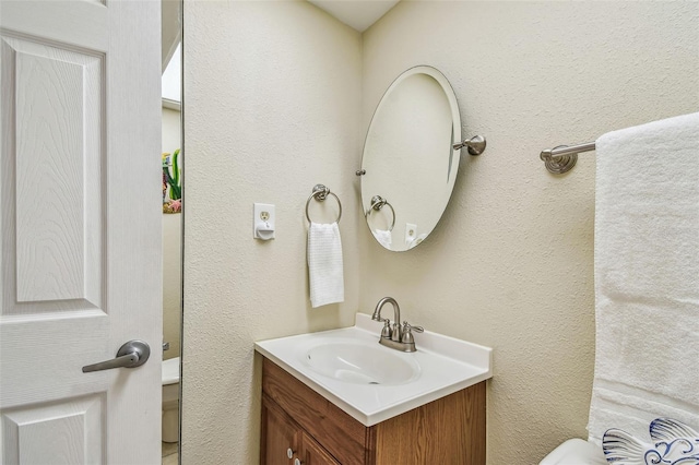 17920 Gulf Blvd Unit 208, Redington Shores, FL 33708 - bathroom with vanity, toilet, and a textured wall