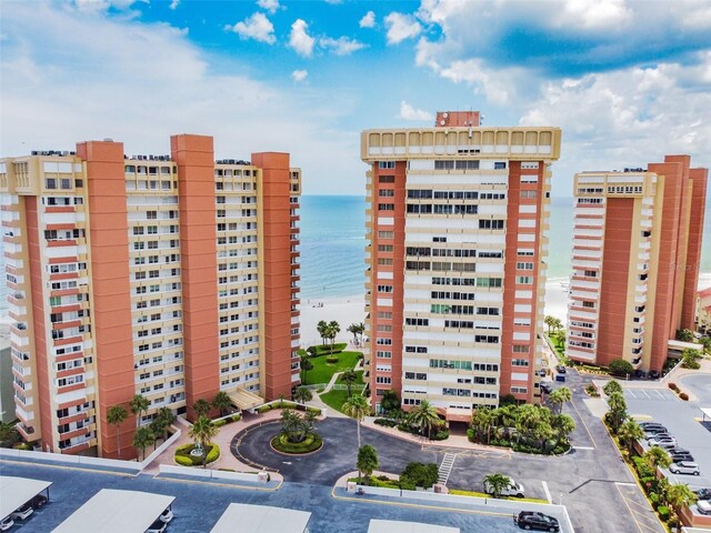 17920 Gulf Blvd Unit 208, Redington Shores, FL 33708 - view of building exterior with a water view and uncovered parking