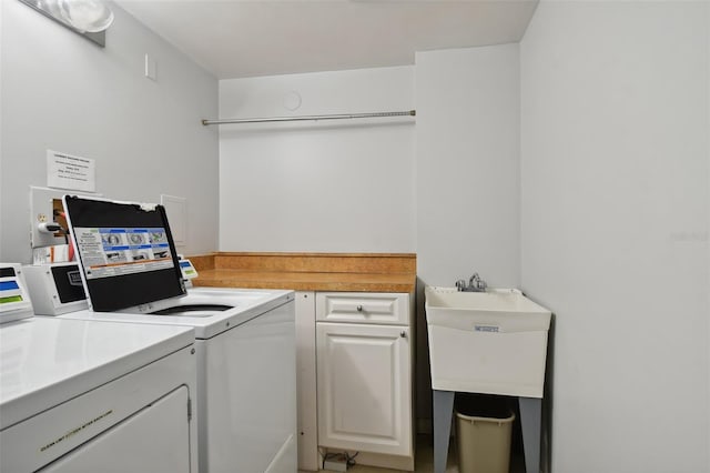 17920 Gulf Blvd Unit 208, Redington Shores, FL 33708 - laundry area with washing machine and clothes dryer and cabinet space