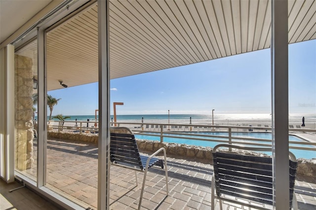 17920 Gulf Blvd Unit 208, Redington Shores, FL 33708 - view of patio with view of water and beach and a balcony