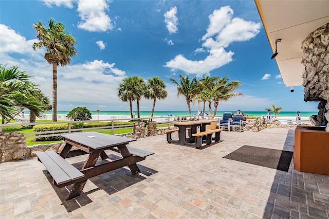 17920 Gulf Blvd Unit 208, Redington Shores, FL 33708 - view of patio / terrace featuring outdoor dining space and view of water and beach