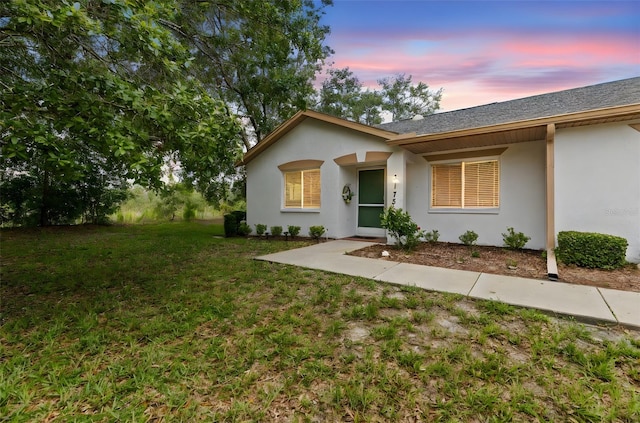 8175 Sturbridge Unit 8175, Weeki Wachee, FL 34613 - ranch-style house featuring stucco siding, a yard, and a shingled roof