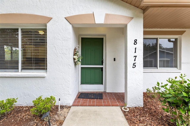 8175 Sturbridge Unit 8175, Weeki Wachee, FL 34613 - view of exterior entry with stucco siding