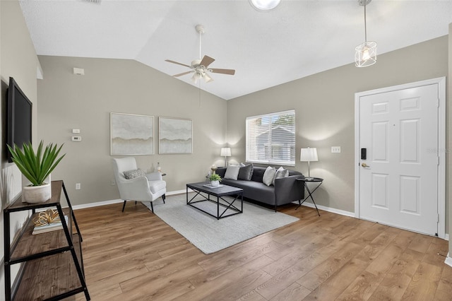 8175 Sturbridge Unit 8175, Weeki Wachee, FL 34613 - living area featuring a ceiling fan, lofted ceiling, and light wood finished floors