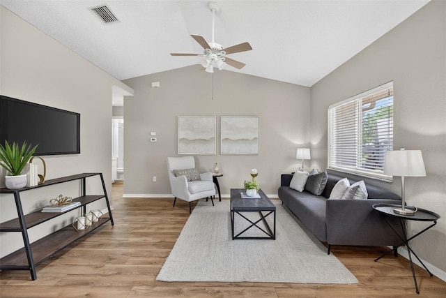8175 Sturbridge Unit 8175, Weeki Wachee, FL 34613 - living area with ceiling fan, vaulted ceiling, and wood finished floors