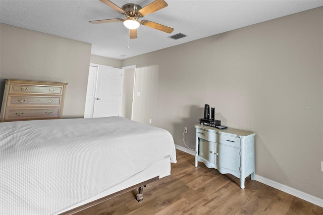 8175 Sturbridge Unit 8175, Weeki Wachee, FL 34613 - bedroom with wood finished floors and a ceiling fan