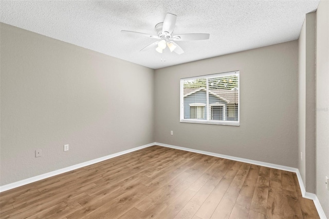 8175 Sturbridge Unit 8175, Weeki Wachee, FL 34613 - spare room with a ceiling fan, wood finished floors, and a textured ceiling