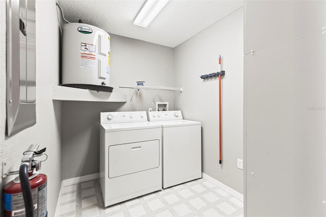 8175 Sturbridge Unit 8175, Weeki Wachee, FL 34613 - laundry area featuring separate washer and dryer, electric water heater, light floors, and a textured ceiling