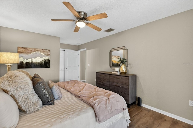 8175 Sturbridge Unit 8175, Weeki Wachee, FL 34613 - bedroom with wood finished floors, ceiling fan, and a closet