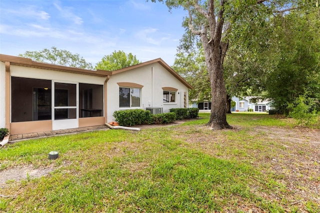 8175 Sturbridge Unit 8175, Weeki Wachee, FL 34613 - view of grassy yard featuring a sunroom