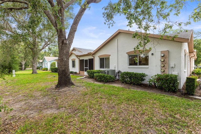 8175 Sturbridge Unit 8175, Weeki Wachee, FL 34613 - view of front of home featuring stucco siding and a front yard