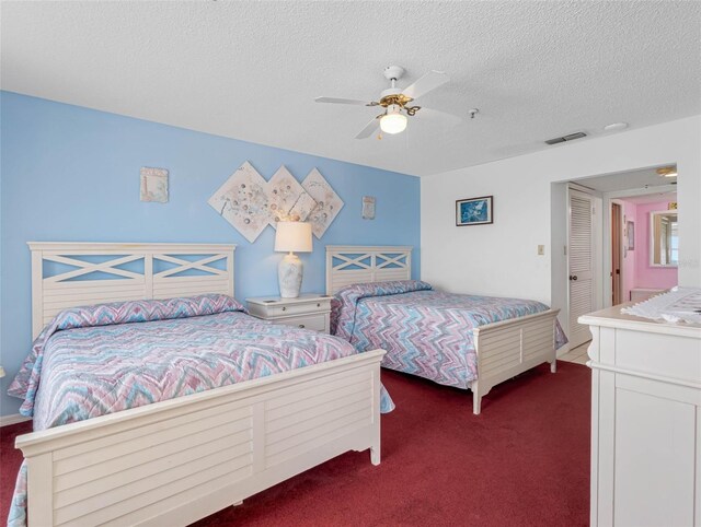 13500 Gulf Blvd Unit 706, Madeira Beach, FL 33708 - bedroom featuring carpet floors, a textured ceiling, and a ceiling fan