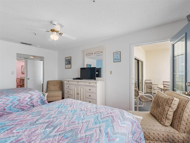 13500 Gulf Blvd Unit 706, Madeira Beach, FL 33708 - bedroom featuring a textured ceiling and ceiling fan