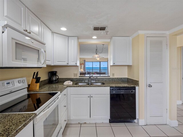 13500 Gulf Blvd Unit 706, Madeira Beach, FL 33708 - kitchen featuring white appliances, a sink, white cabinets, light tile patterned floors, and recessed lighting