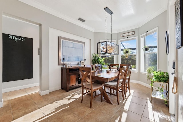 15936 Ternglade Dr, Lithia, FL 33547 - dining room with ornamental molding, light tile patterned flooring, and baseboards