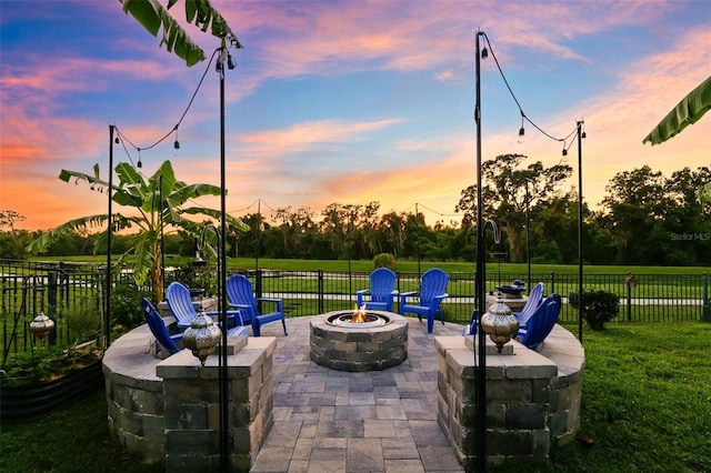 15936 Ternglade Dr, Lithia, FL 33547 - patio terrace at dusk featuring a fire pit and a patio