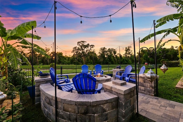 15936 Ternglade Dr, Lithia, FL 33547 - patio terrace at dusk featuring an outdoor fire pit and a patio