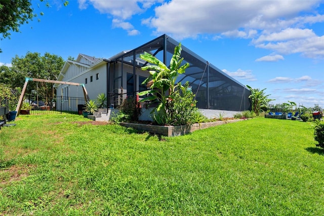 15936 Ternglade Dr, Lithia, FL 33547 - rear view of house with glass enclosure and board and batten siding