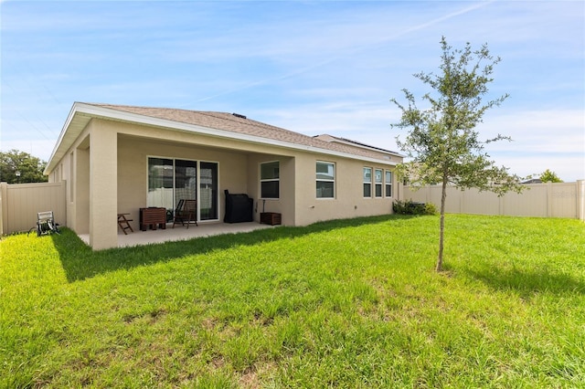 12401 Shining Willow St, Riverview, FL 33579 - back of house featuring stucco siding and a patio area