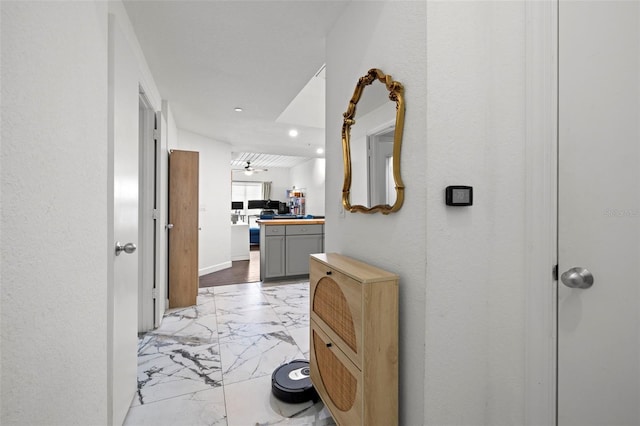 2410 W Azeele St Unit 214, Tampa, FL 33609 - corridor featuring light marble finish floors and recessed lighting