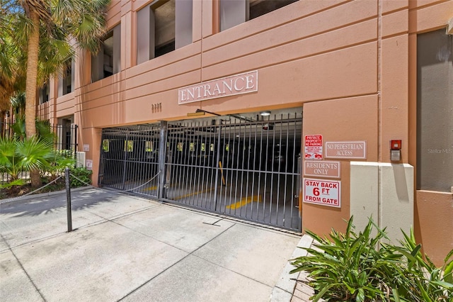 2410 W Azeele St Unit 214, Tampa, FL 33609 - view of building exterior with driveway and a garage