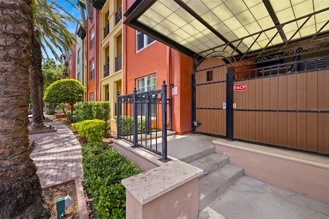 2410 W Azeele St Unit 214, Tampa, FL 33609 - doorway to property with a gate