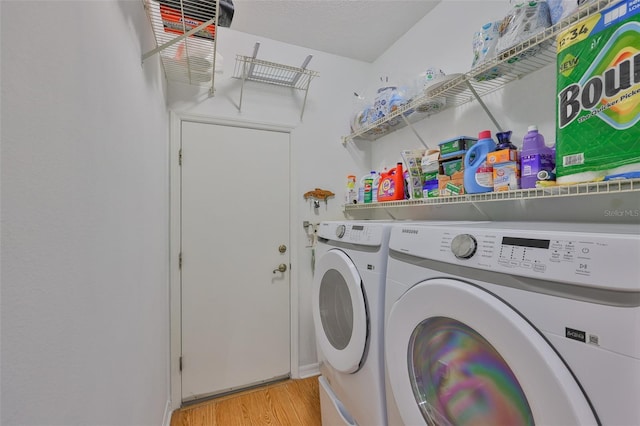 2316 Lyndhurst Dr, Sun City Center, FL 33573 - laundry area with washer and dryer and light wood finished floors