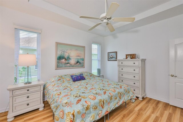 2316 Lyndhurst Dr, Sun City Center, FL 33573 - bedroom with light wood-style floors and ceiling fan