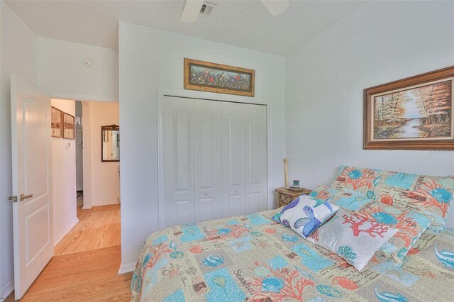 2316 Lyndhurst Dr, Sun City Center, FL 33573 - bedroom featuring light wood-type flooring, a closet, ceiling fan, and baseboards