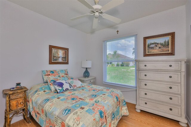 2316 Lyndhurst Dr, Sun City Center, FL 33573 - bedroom featuring light wood finished floors, baseboards, and a ceiling fan