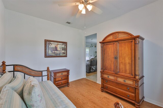 2316 Lyndhurst Dr, Sun City Center, FL 33573 - bedroom featuring light wood-style flooring, baseboards, and ceiling fan