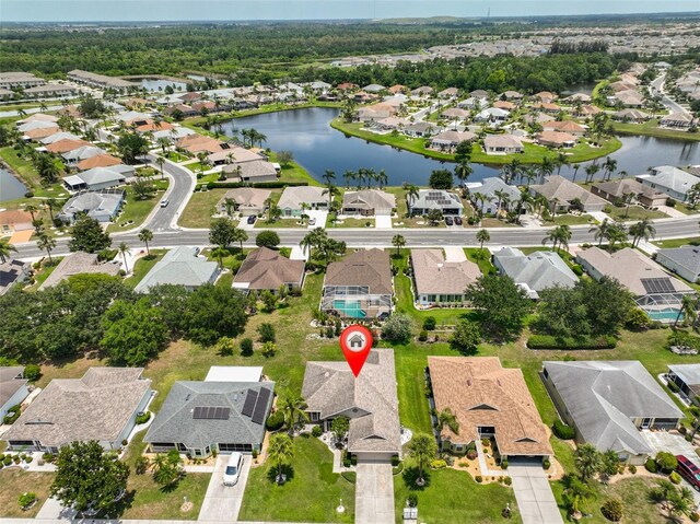 2316 Lyndhurst Dr, Sun City Center, FL 33573 - aerial overview of property's location with nearby suburban area and a large body of water