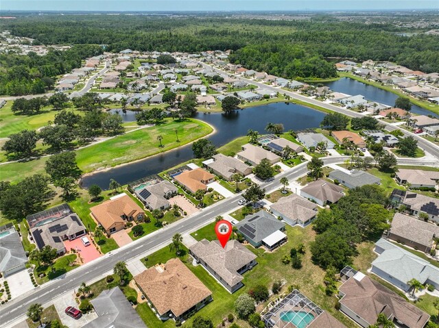 2316 Lyndhurst Dr, Sun City Center, FL 33573 - aerial overview of property's location featuring nearby suburban area, a nearby body of water, and a heavily wooded area