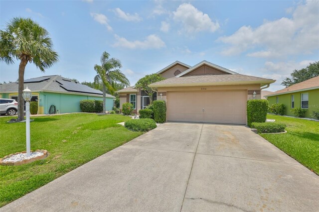 2316 Lyndhurst Dr, Sun City Center, FL 33573 - ranch-style home with a front lawn, concrete driveway, an attached garage, and stucco siding