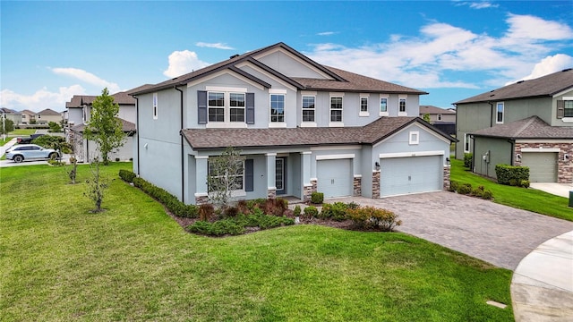 7628 Surf Reed Way, Wesley Chapel, FL 33545 - view of front of house featuring stucco siding, a front yard, driveway, a porch, and a shingled roof