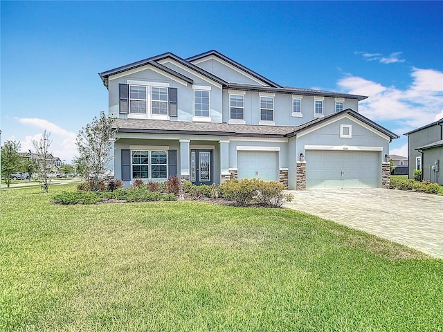 7628 Surf Reed Way, Wesley Chapel, FL 33545 - view of front of home with stucco siding, a front yard, decorative driveway, and stone siding