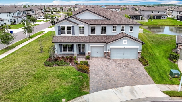7628 Surf Reed Way, Wesley Chapel, FL 33545 - view of front facade featuring stucco siding, driveway, a residential view, and stone siding
