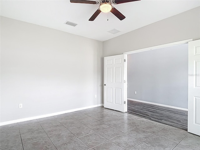 7628 Surf Reed Way, Wesley Chapel, FL 33545 - tiled spare room with ceiling fan and baseboards