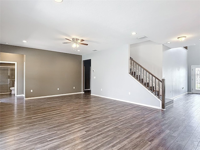 7628 Surf Reed Way, Wesley Chapel, FL 33545 - unfurnished living room featuring dark wood-style floors, ceiling fan, recessed lighting, baseboards, and stairway