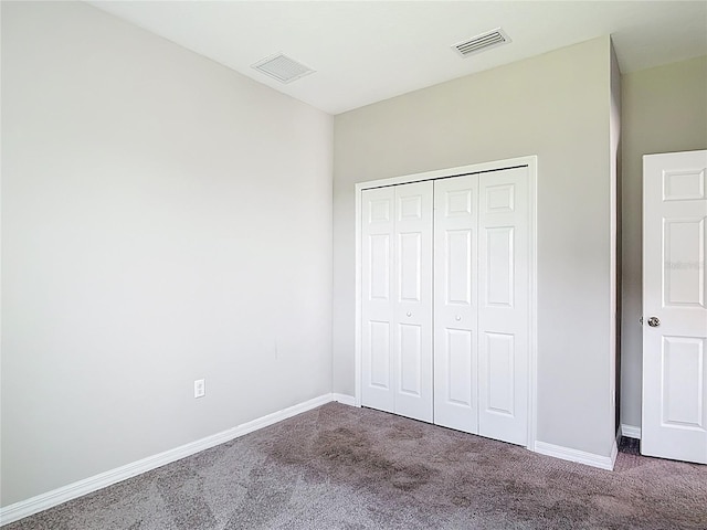 7628 Surf Reed Way, Wesley Chapel, FL 33545 - unfurnished bedroom featuring carpet flooring, baseboards, and a closet