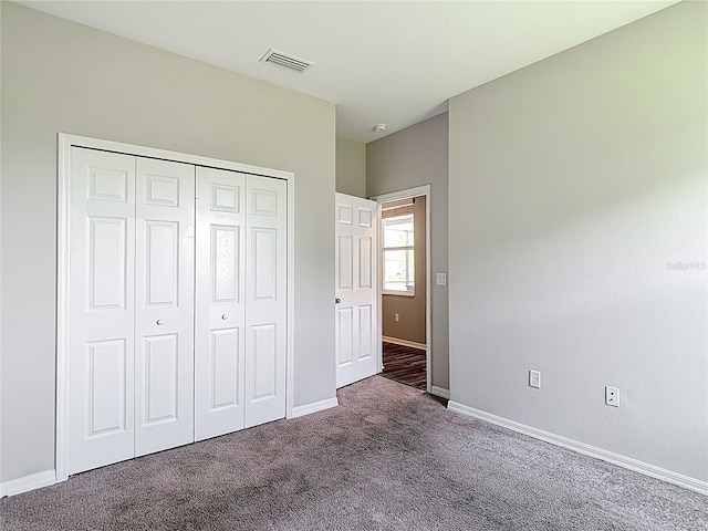 7628 Surf Reed Way, Wesley Chapel, FL 33545 - unfurnished bedroom featuring carpet flooring, baseboards, and a closet