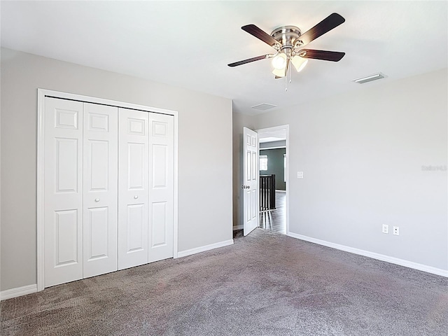 7628 Surf Reed Way, Wesley Chapel, FL 33545 - unfurnished bedroom featuring carpet, baseboards, a closet, and ceiling fan