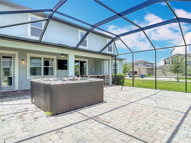 7628 Surf Reed Way, Wesley Chapel, FL 33545 - view of patio / terrace with a ceiling fan, a lanai, a hot tub, and a residential view
