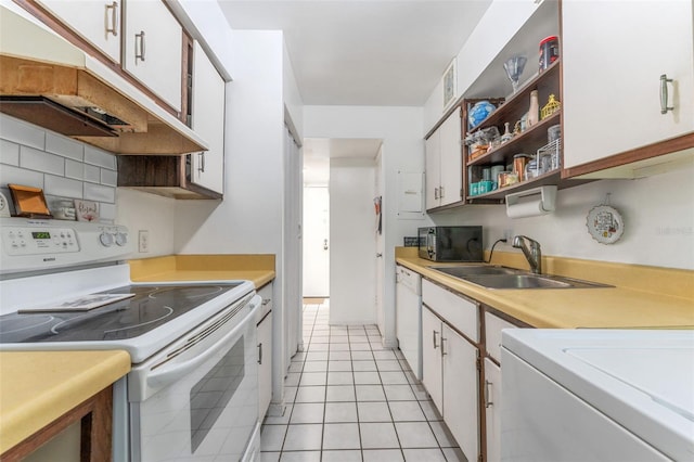501 E Bay Dr Unit 102, Largo, FL 33770 - kitchen featuring white appliances, a sink, and light countertops