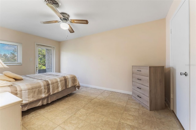 501 E Bay Dr Unit 102, Largo, FL 33770 - bedroom with ceiling fan, access to outside, and baseboards