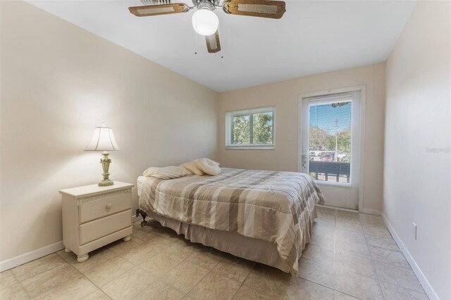 501 E Bay Dr Unit 102, Largo, FL 33770 - bedroom featuring access to outside, baseboards, and ceiling fan