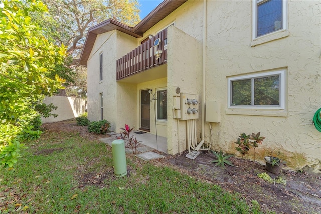 501 E Bay Dr Unit 102, Largo, FL 33770 - back of house with a balcony and stucco siding