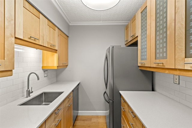 3325 Bayshore Blvd Unit C36, Tampa, FL 33629 - kitchen with a sink, decorative backsplash, a textured ceiling, baseboards, and light countertops