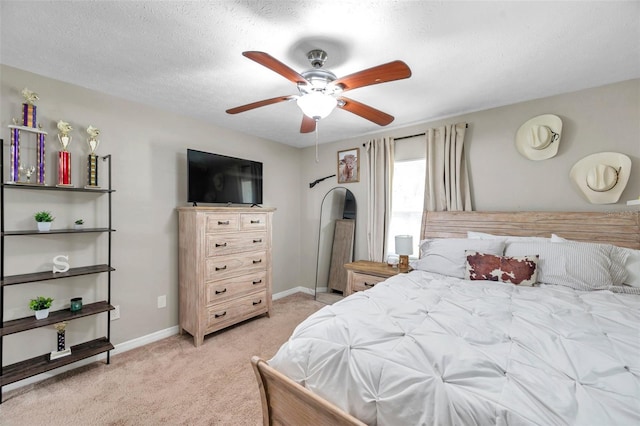 316 Jenkins Ave, Brooksville, FL 34604 - bedroom featuring light carpet, baseboards, and a ceiling fan