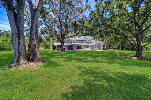 1670 Fox Rd, Clearwater, FL 33764 - view of green lawn with glass enclosure